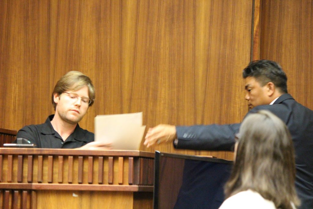 Ginseng Mileur in on the witness stand and prosecuting attorney Robert Rivera to the right. (6.27.16) Photo by Wendy Osher.