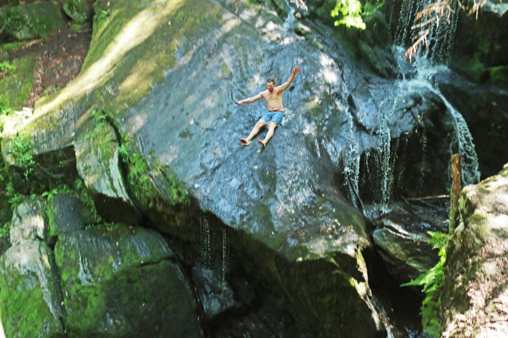 A swimmer enjoys the rock slide at Connecticut's Enders Falls. Photo credit: Travel Channel.