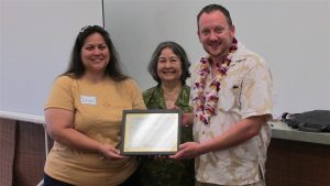 Dawn DeRego (right), Na Hale O Maui’s outgoing president, and Cassandra Abdul, NHOM’s new executive director, present Justin Hughey with a certificate of appreciation, honoring his six years of service as a board member with NHOM from 2010 to 2016.