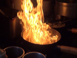Food fires up on the stove at Maui Thai Bistro. Photo by Kiaora Bohlool.