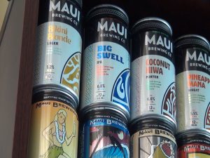 Original Maui Brewing Co. can design on the bottom, newly-branded cans on the top. Photo by Kiaora Bohlool.