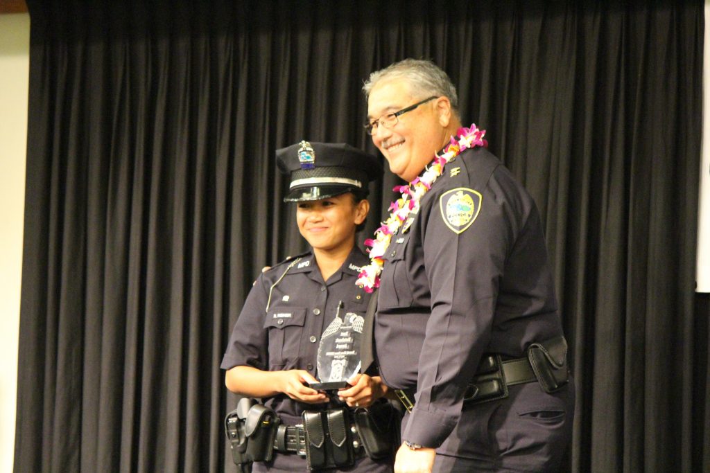 Mary Rose Reiner receiving the Best Notebook Award. Maui Police Department 83rd Recruit Class and Emergency Services Dispatchers Graduation. Photo by Wendy Osher.