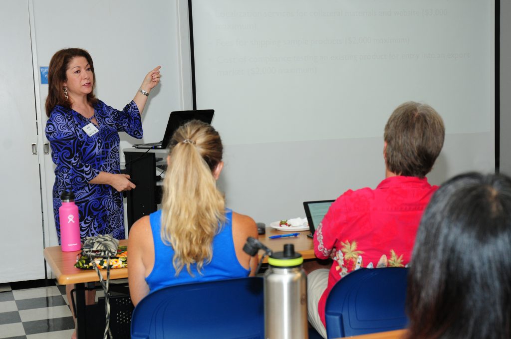 Jamie Lum of DBEDT spoke to workshop attendees on the Hawai‘i State Trade and Export Promotion Assistance Program, which helps qualified companies with export marketing assistance. DBEDT photo.