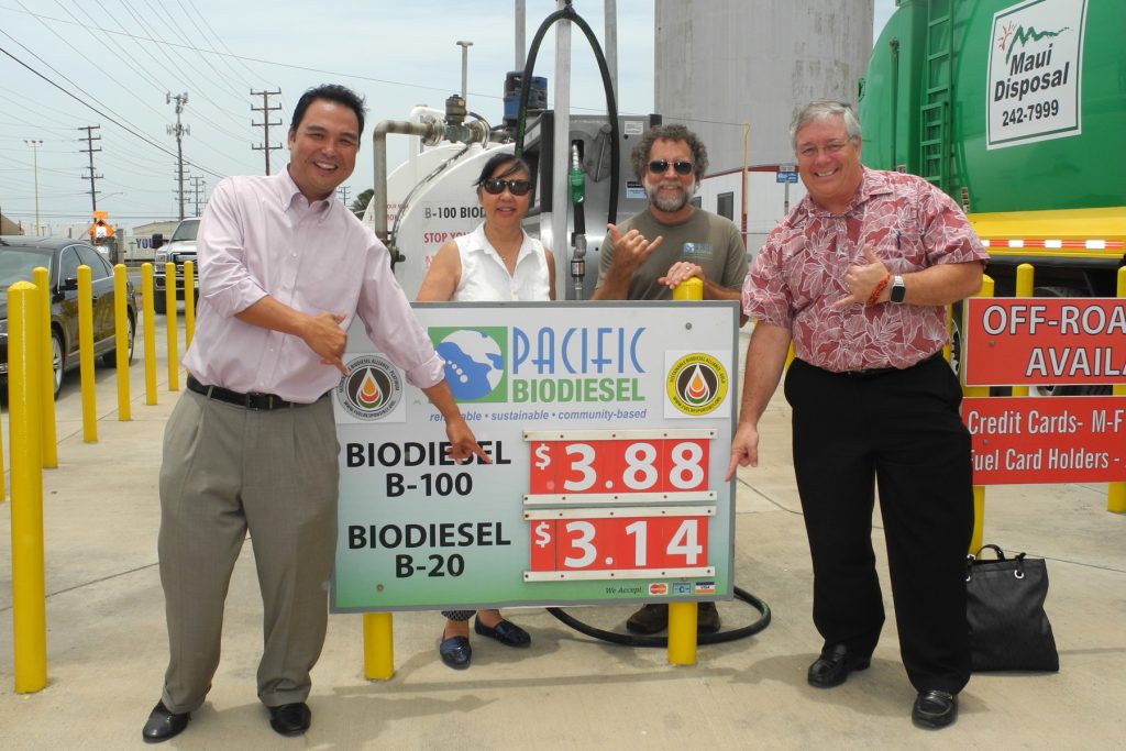 Maui County Council Vice Chair Don Guzman, who proposed the tax exemption, shows his support for the biodiesel price rollback earlier today with Kelly and Bob King, Pacific Biodiesel founders, and Councilmember Don Couch. Photo credit: Pacific Biodiesel
