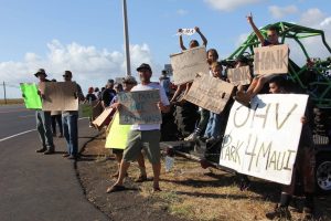 On Friday, July 8, over 60 motocross enthusiasts participated in a sign waving demonstration along Mokulele Highway. Photo: Tiare Lawrence