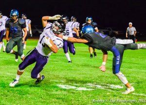 King Kekaulike defensive back Dylan Poouahi grabs the horse collar of Kamehameha Maui's Trystin Catan during first-half action Thursday at King Kekaulike Stadium.m Photo by Rodney S. Yap.