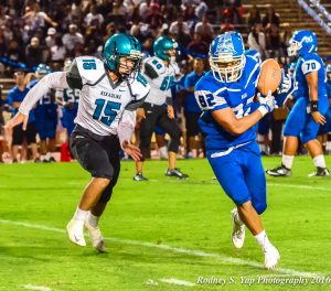 Maui High's Mark Ranchez (82) catches this pass in front of King Kekaulike defenderKayden Mckinnon (15). Photo by Rodney S. Yap. 