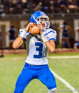 Maui High quarterback John Michael Mokiao-Duvauchelle looks for an open receiver during second-half action Friday at Lahainaluna. Photo by Rodney S. Yap.