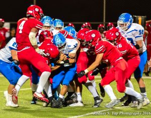 Lahainaluna's defense swarms all over Maui High during second-half action Friday at Sue Cooley Stadium. Photo by Rodney S. Yap.