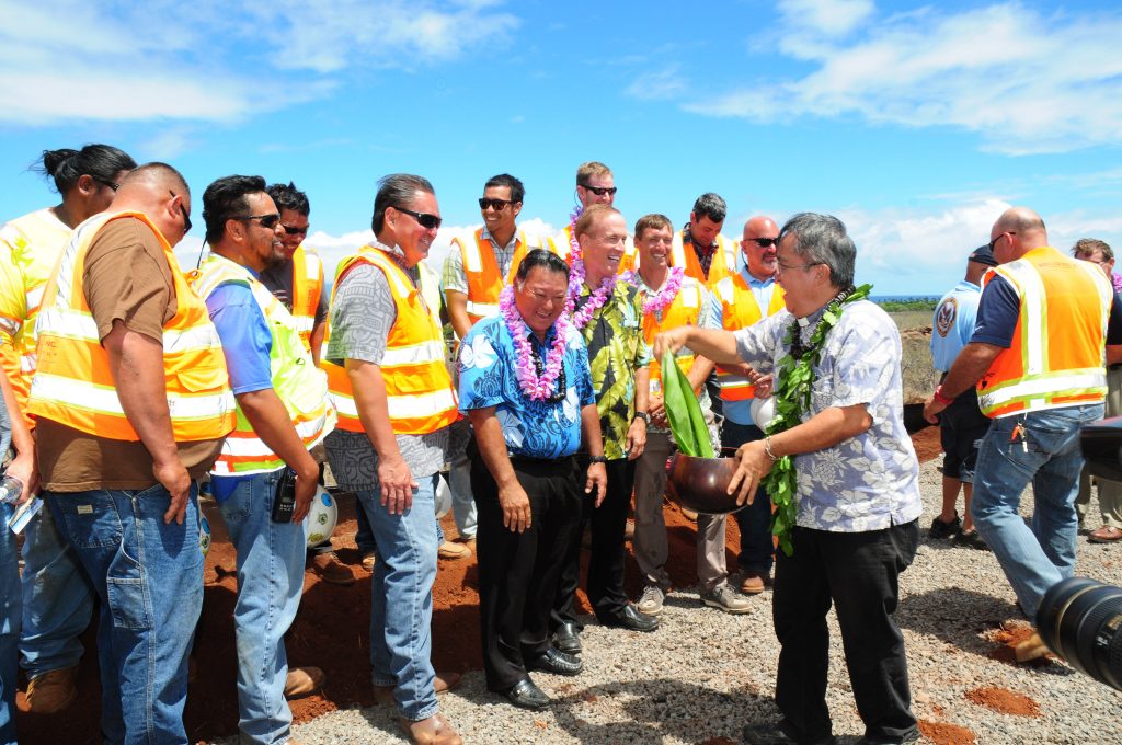 Reverend Alika blesses some of the crew that will be working on the West Maui Hospital and Medical Center project. Mayor and hospital developer (on the right of the Mayor) pictured in the middle.