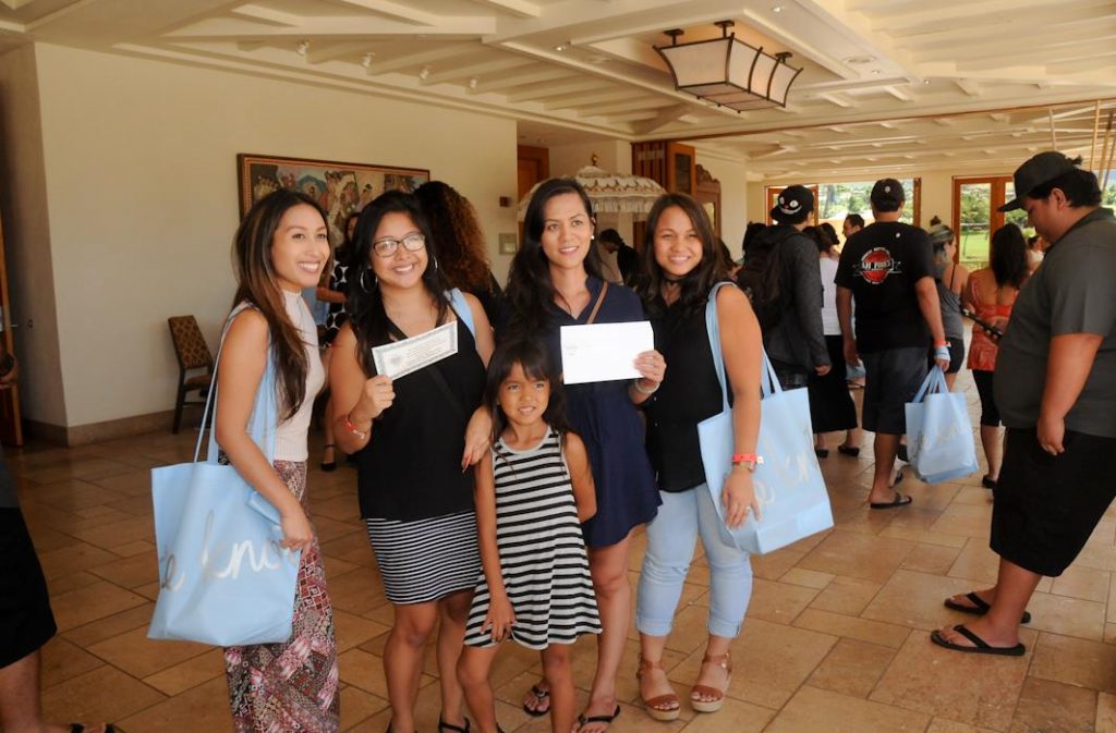 Winners show their door prizes won at the 21st annual Maui Wedding Expo.