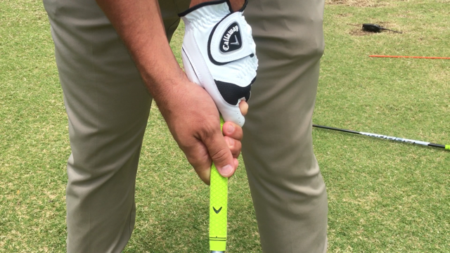 PHOTO 4: To make a stronger grip, rotate your hands to the right. Your left hand is now more on top of the club and your right hand is more underneath the club.