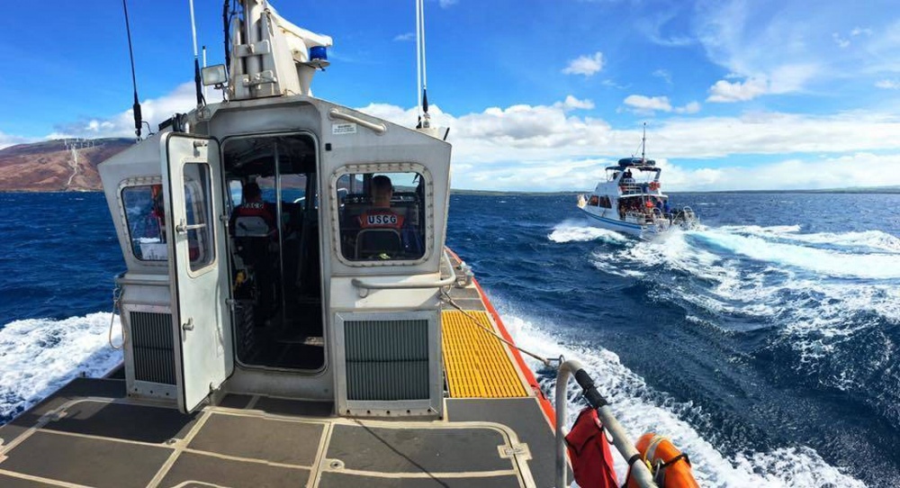  A Coast Guard Station Maui 45-foot Response Boat-Medium crew escorts the commercial passenger vessel Maka Koa back to port five miles south of Maalaea, Maui, Aug. 14, 2016. The Coast Guard responded to a report of the 43-foot vessel, with 21 people aboard, taking on water off Maui. (U.S. Coast Guard photo by Petty Officer 2nd Class Rob Lester/Released) 