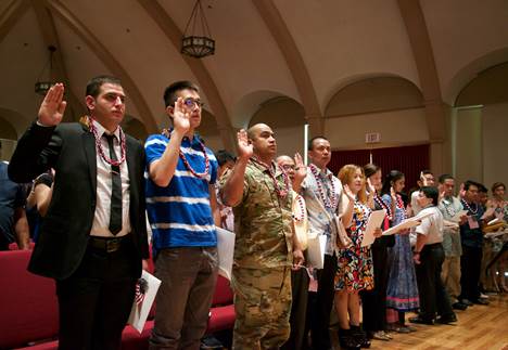  77 candidates representing 26 countries are sworn in as new American citizens today at Mission Memorial Auditorium. 