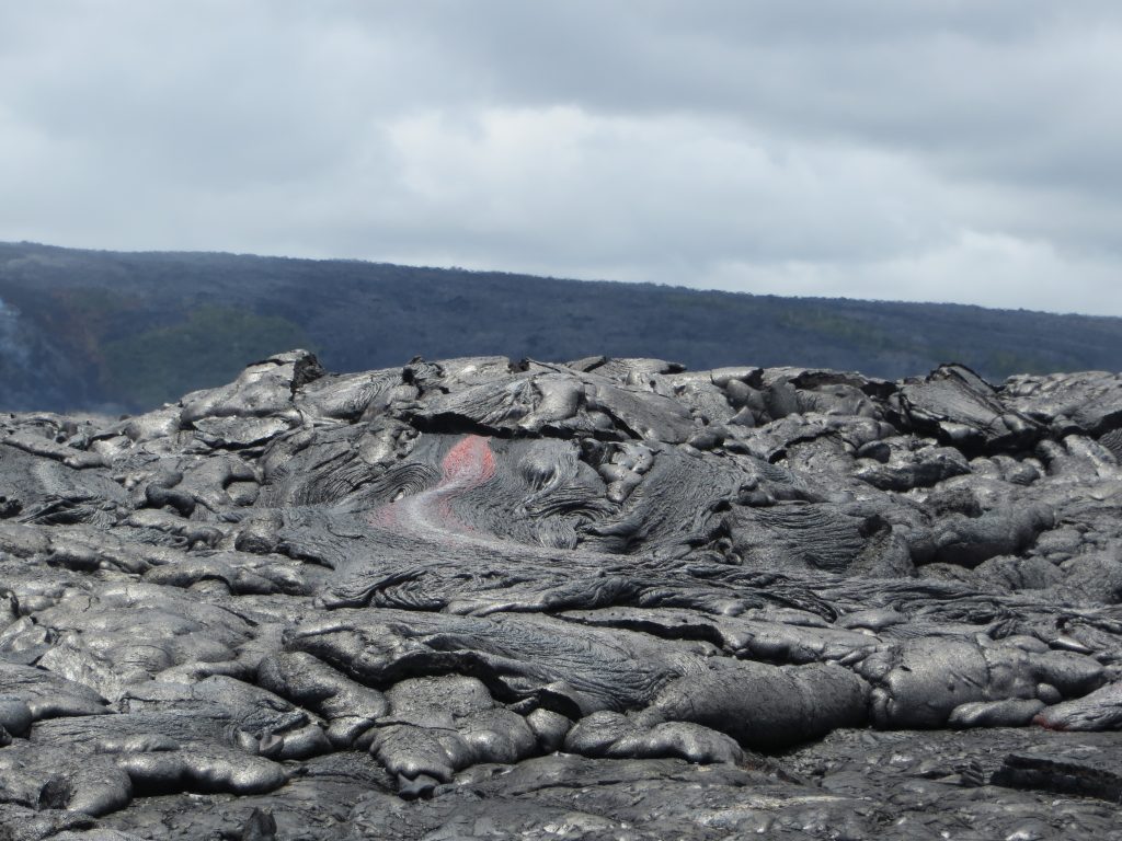 Upslope of the ocean entry, sluggish pāhoehoe lava continued to break out in several places along the margins of the flow. (8.2.16) Photo courtesy: USGS/HVO