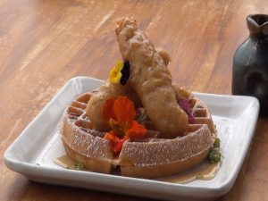 Cane & Canoe's version of chicken and waffles as part of its Sunday brunch menu. Photo by Kiaora Bohlool.