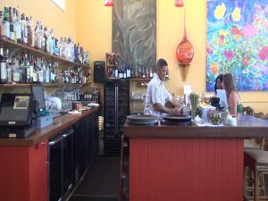 Bartender in action during happy hour at Hali‘imaile General Store, Monday through Friday from 3 to 5:30 p.m. Photo by Kiaora Bohlool.
