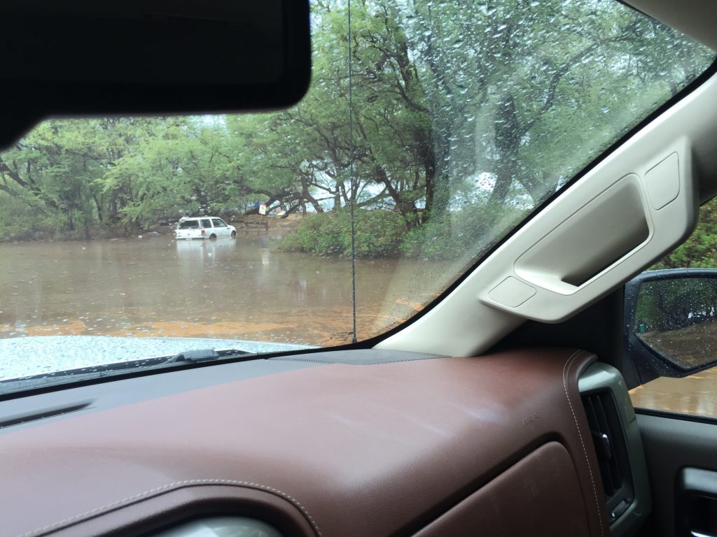 Vehicles stuck in flood waters along the Honoapiilani Highway in West Maui caused major delays in traffic as motorists slowed to look at the remnant flooding off the road. PC: 9.14.16 by Jared James