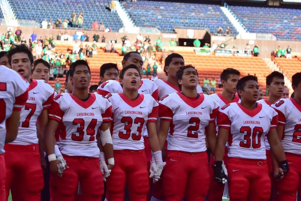 Lahainaluna sings its alma mater six times when playing on the road. Here they sing before the start of the D-II state championship game. Photo by Glen Pascual.
