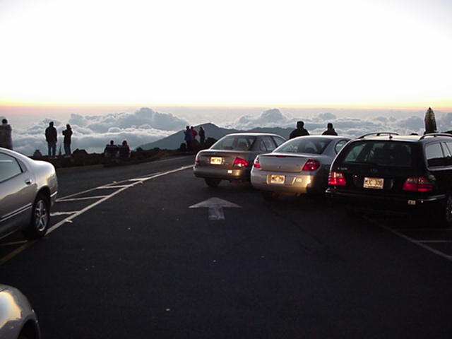 Cars block the traffic lane in the summit parking lot (10,023 feet of elevation).