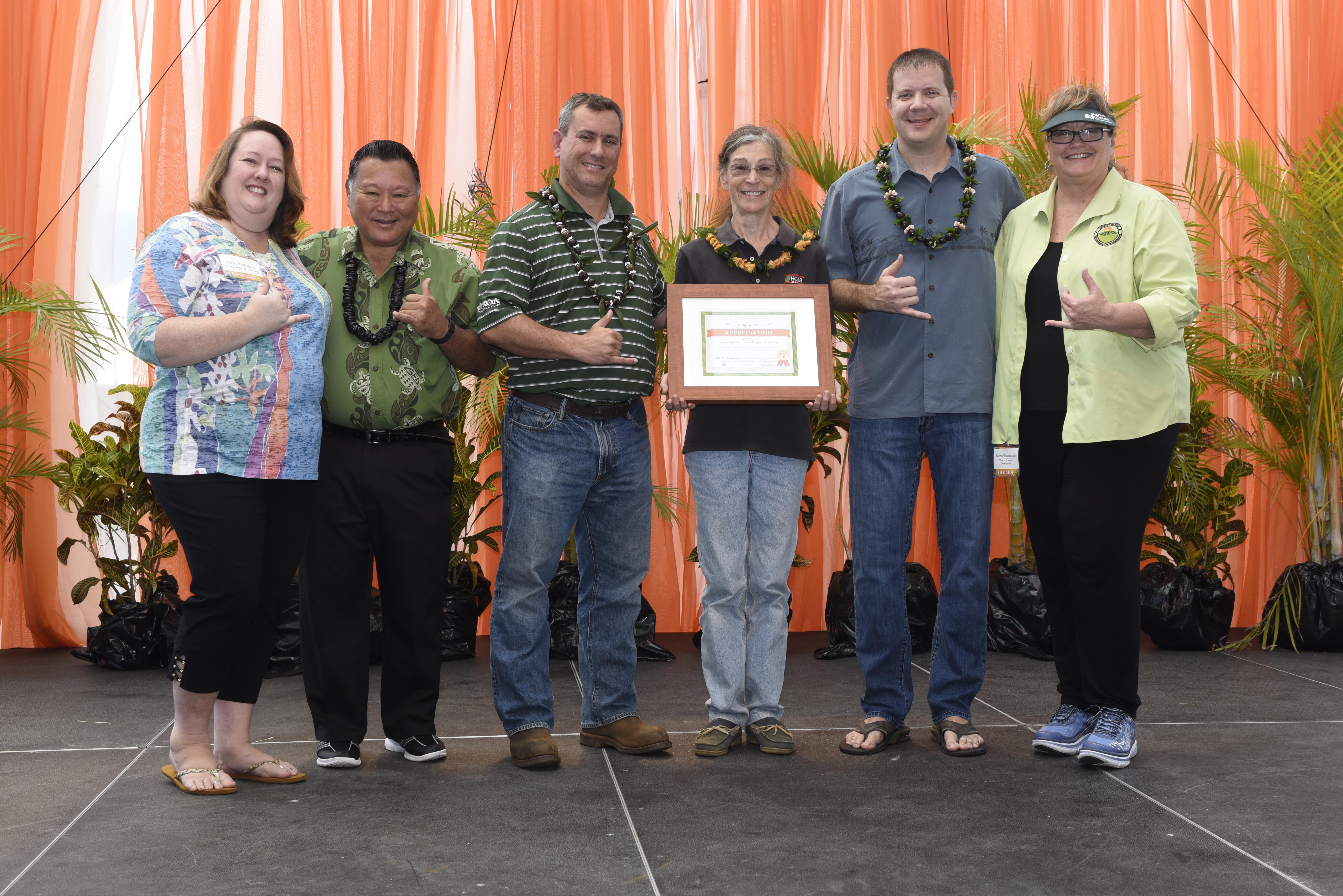 A special tribute to HC&S was presented on Saturday, in honor of 140 years of supporting small businesses and value-added manufacturers in the County of Maui. Pictured from left: Pam Tumpap (Maui Chamber of Commerce), Mayor Alan Arakawa, Rick Volner (HC&S), Anna Skrobecki (HC&S), Dan Ligienza (HC&S), and Teena Rasmussen (County of Maui Mayor’s Office of Economic Development). Photo by Jose Morales