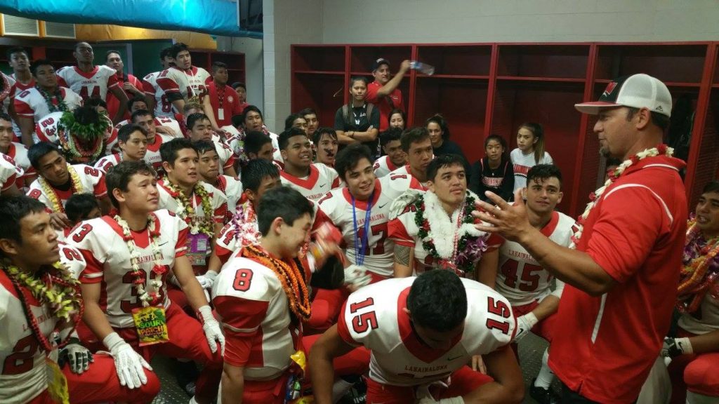 Lahainaluna coach Kenui Watson talks to the team in the locker room at Aloha Stadium following its Division II state championship victory over Kapaa. Photo by Glen Pascual.