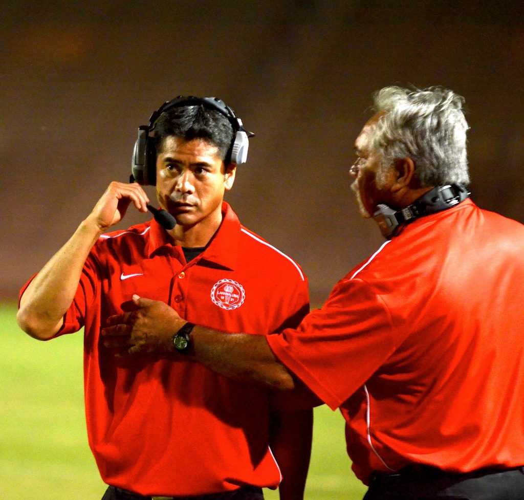Co-head coaches Garret Tihada and Bobby Watson on the sidelines during an MIL game. File photo by Rodney S. Yap.