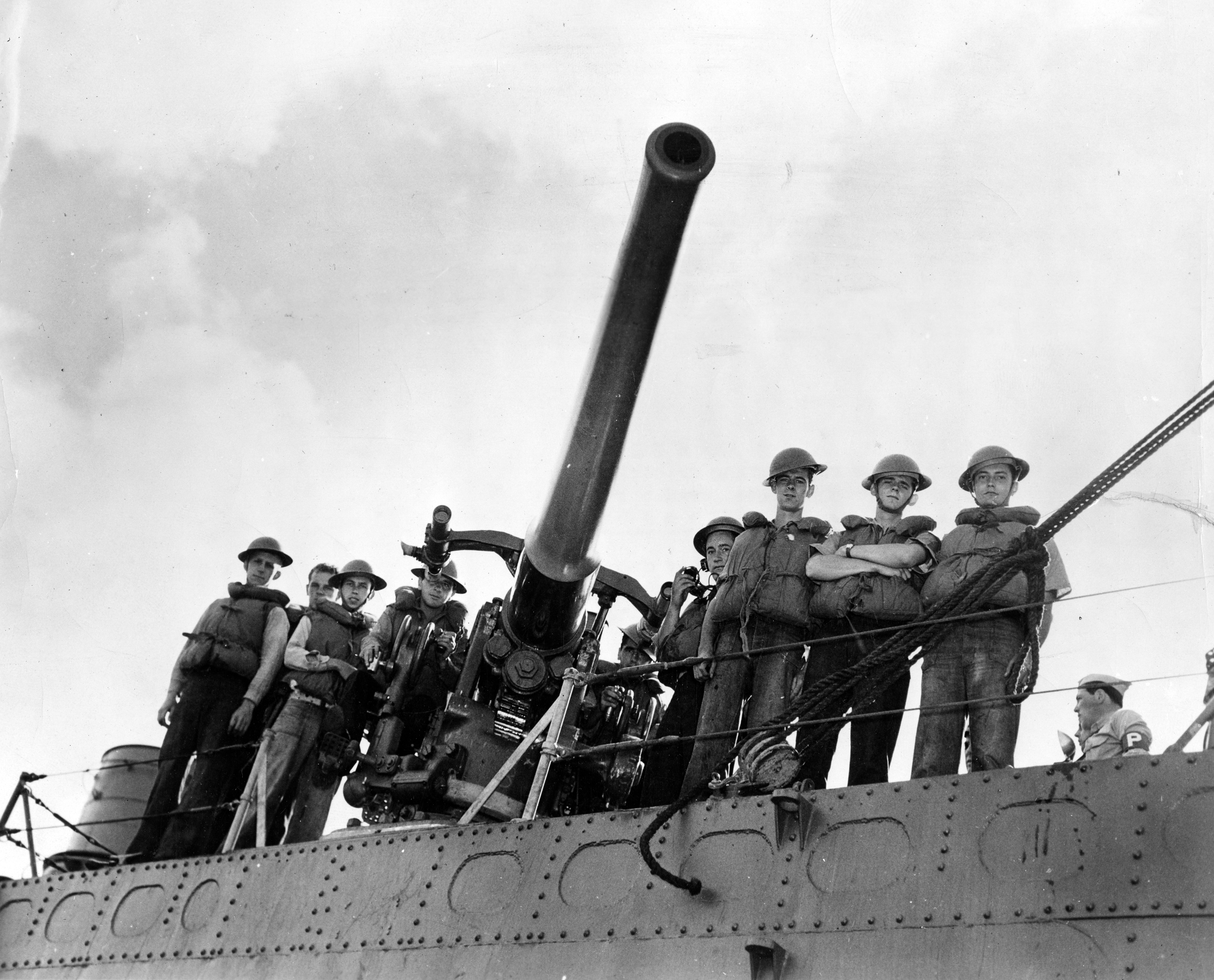 USS Ward's gun crew pose at their weapon after the destroyer sank a mini submarine outside of Pearl Harbor and "fired the first shot" of the war in the Pacific. Credit: Naval History and Heritage Command NH 97446