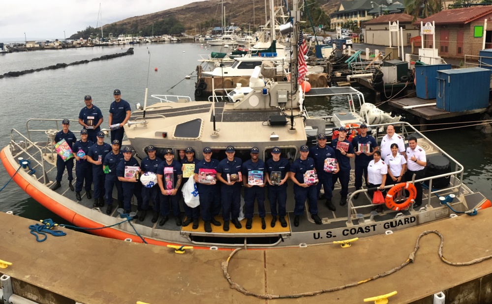 Members of Coast Guard Station Maui team up with the Salvation Army to deliver 800 toys and clothes to the children of Molokai Dec. 9, 2016. The Coast Guard has been assisting in community needs around the nation for more than 200 years. (U.S. Coast Guard photo by Petty Officer 2nd Class Rob Lester/Released)